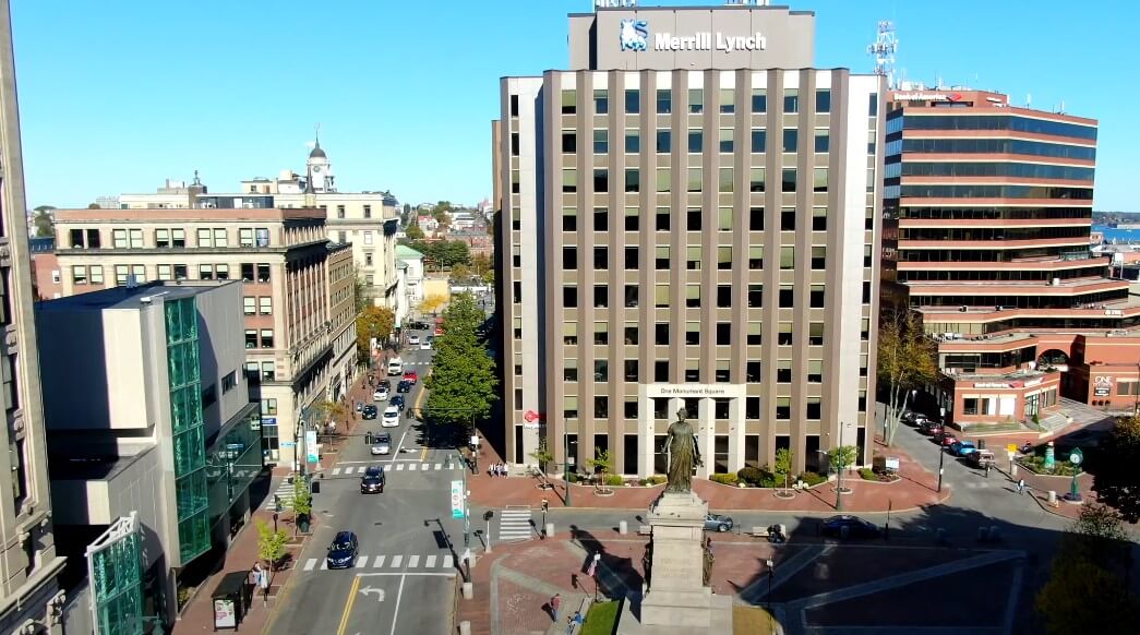 A bustling cityscape, showcasing Portland's urban core with its mix of modern and historic architecture