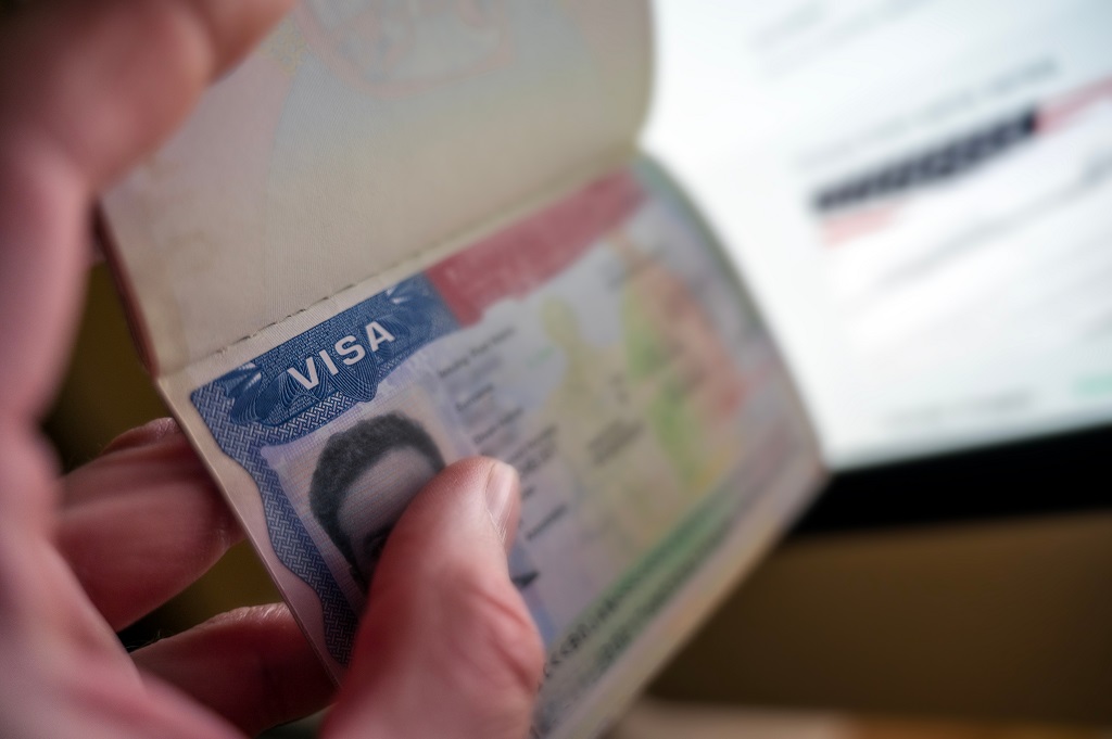 Close-up of passport with visa sticker illustrating international visa and entry authorization requirements